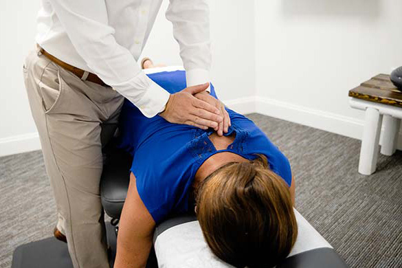 Chiropractor Rochester Hills MI Erik Brace With Patient Chiropractor Rochester Hills MI Erik Brace With Patient